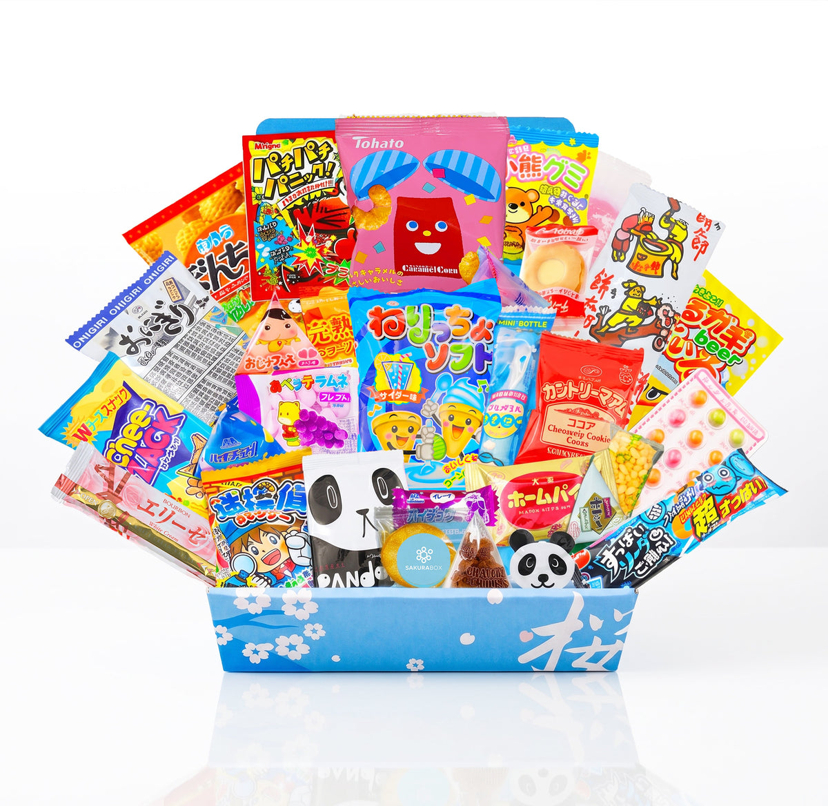 Thirty Japanese snacks displayed in an open blue Sakura Box