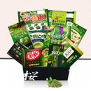 Open black Sakura Box with matcha snack assortment and matcha powder
