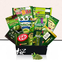 Open black Sakura Box with matcha snack assortment and matcha powder