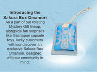 Blue Sakura Box Omamori keepsake beside its pouch