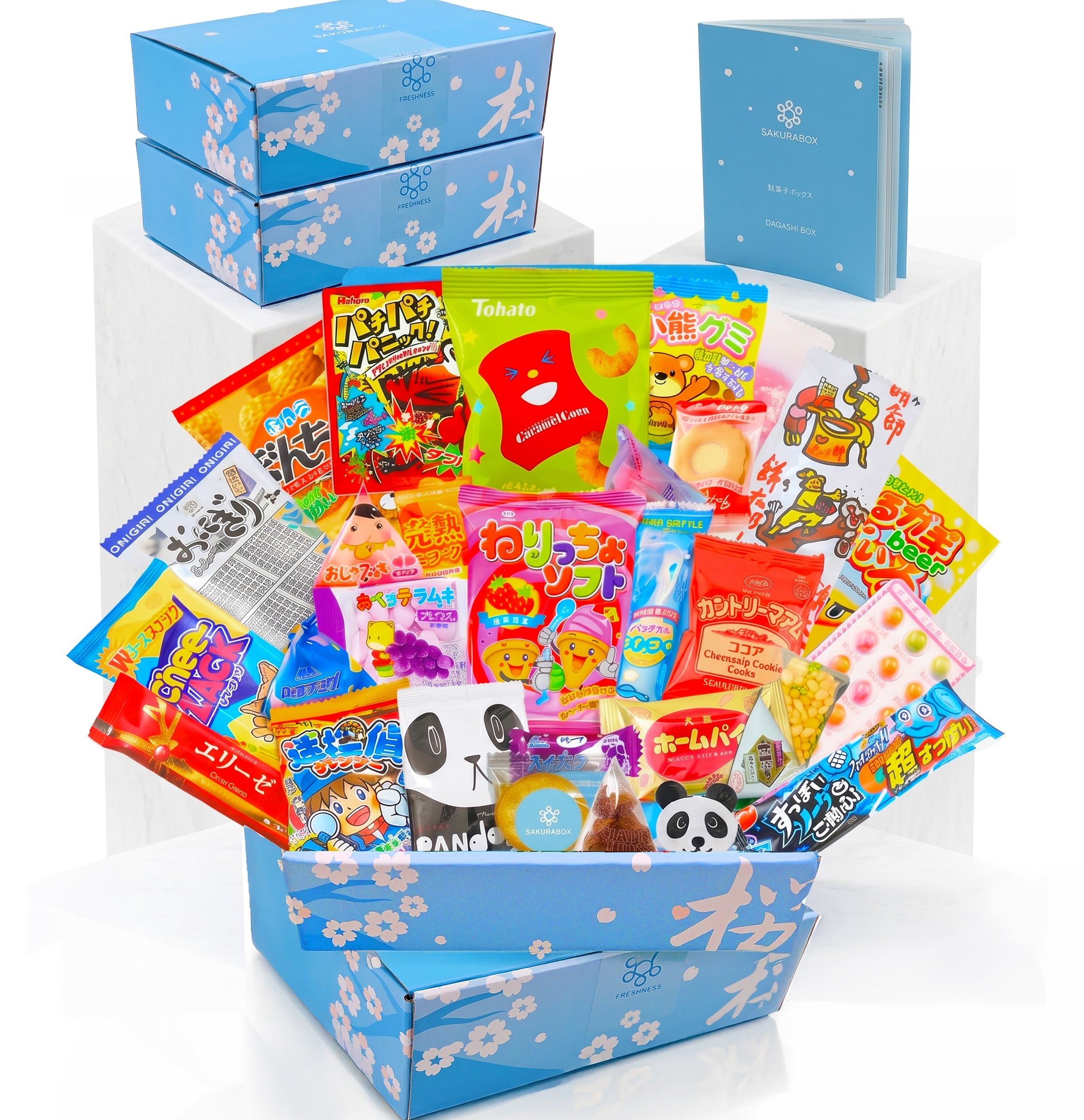 Two Sakura Box 30-piece Japanese snack sets presented with assorted snacks