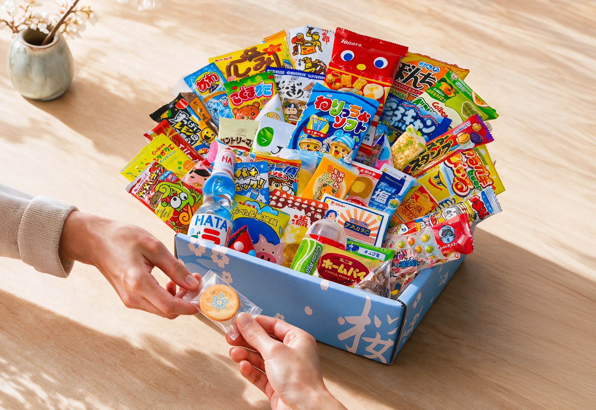A Sakura Box assortment shared in a warm home setting